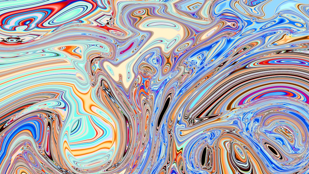 Swirling colors and patterns create an abstract image. - Photo by Logan Voss on Unsplash