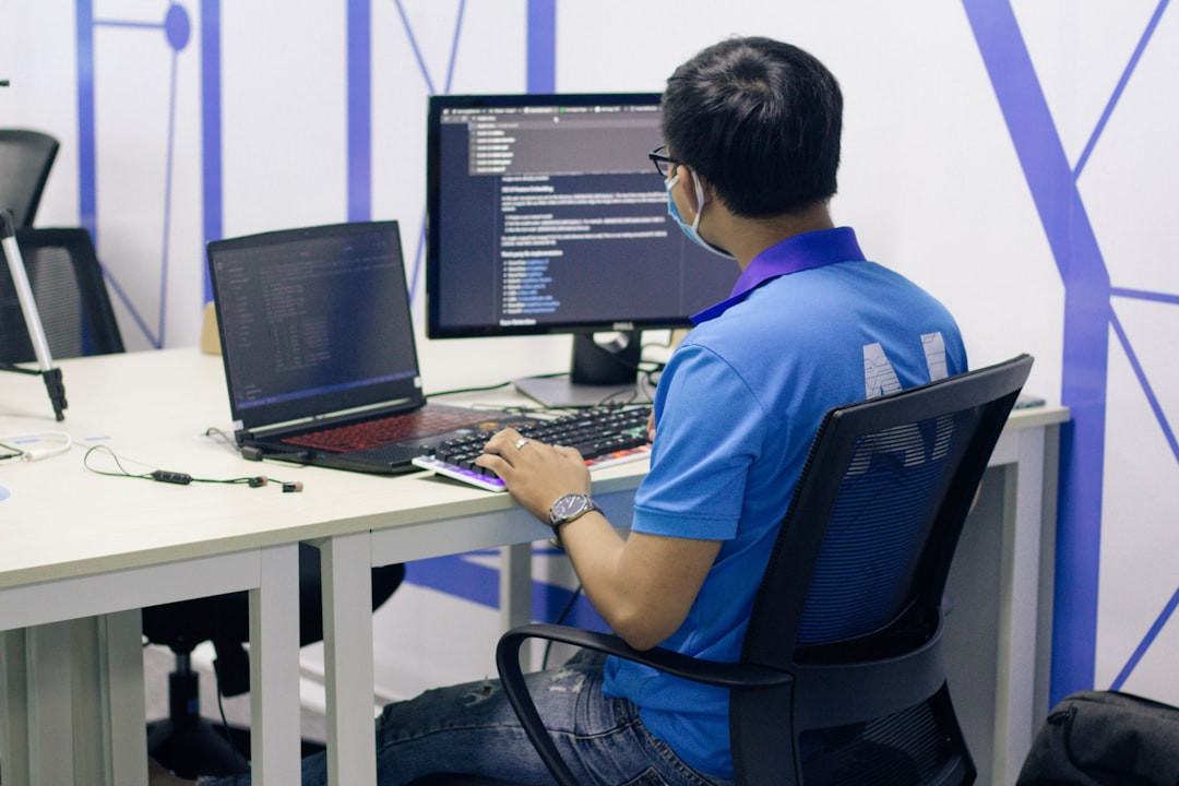 boy in blue t-shirt sitting on black office rolling chair in front of computer - Photo by Nguyen Dang Hoang Nhu on Unsplash